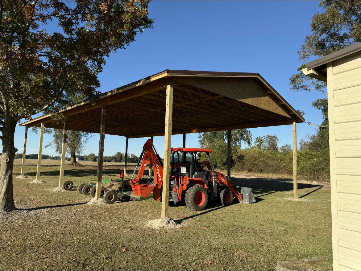 Large open-sided equipment shelter with timber posts and framed roof