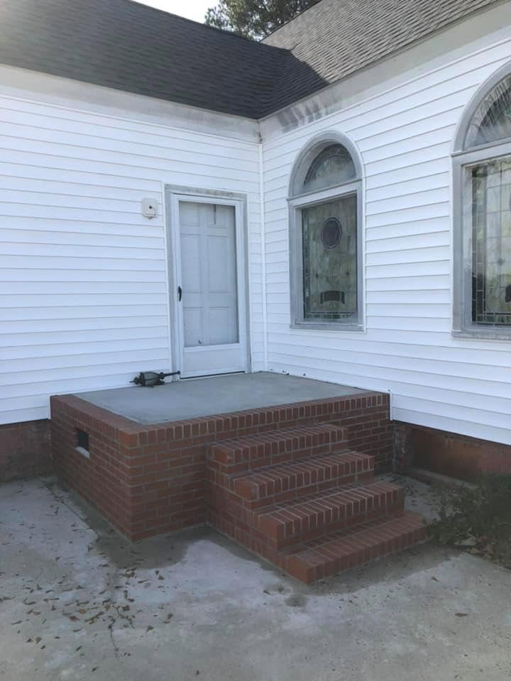 New brick entry steps and landing at a side door