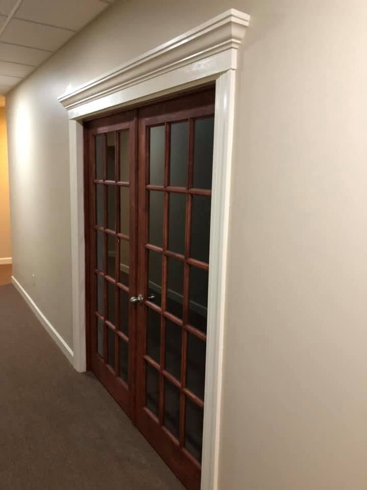 Interior French doors with custom painted crown molding and casing
